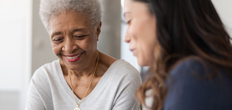 An older adult reflecting at home