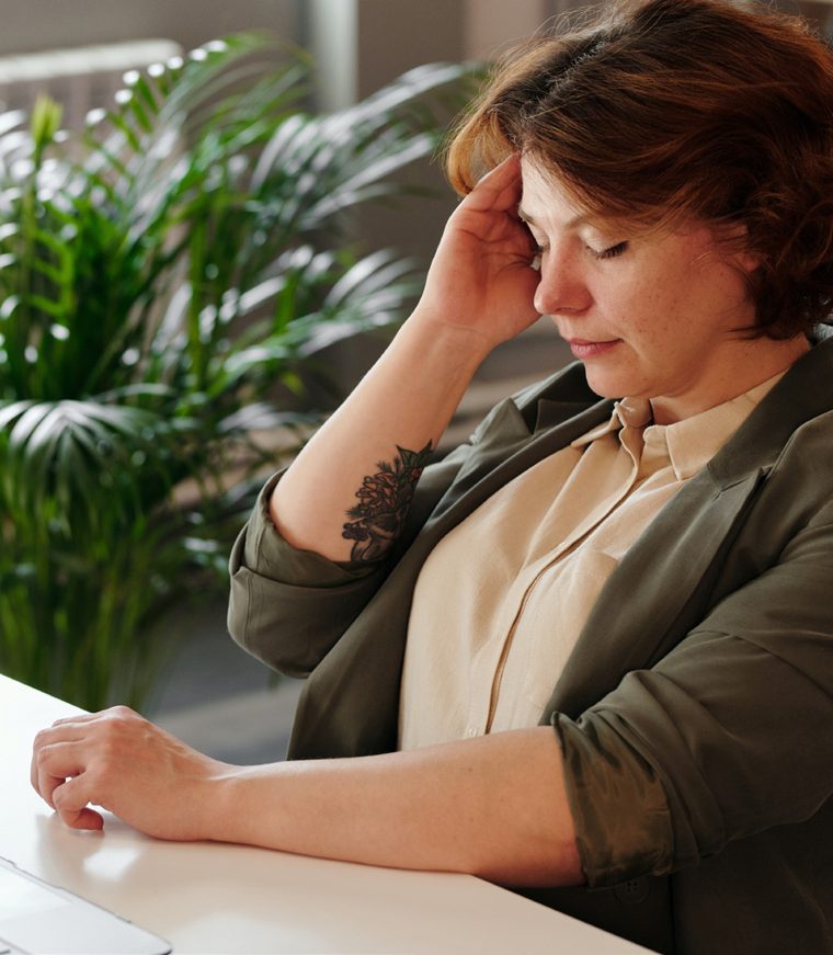 A person experiencing head pain